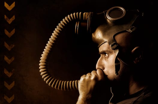 Man with gas mask in a grunge background