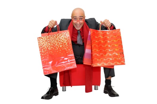 Businessman posing with shopping bags isolated in white