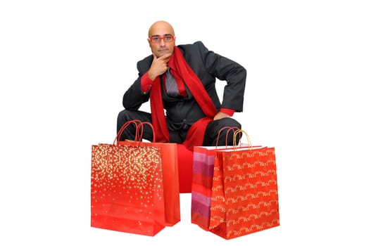 Businessman posing with shopping bags isolated in white