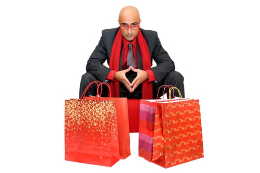 Businessman with shopping bags isolated in white