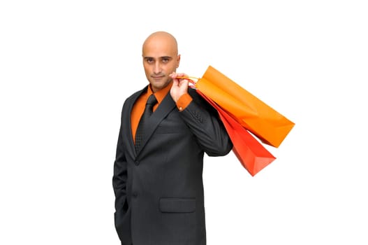Elegant businessman with shopping bags isolated in white