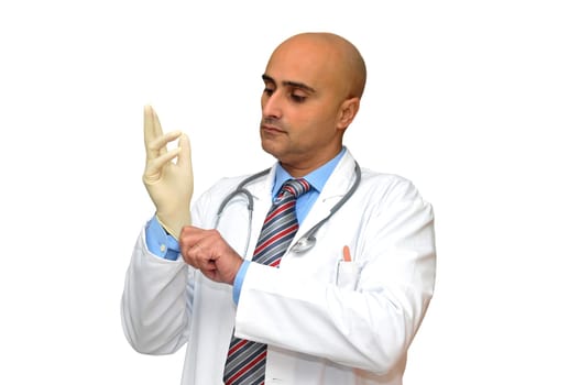 Doctor putting his gloves isolated in white