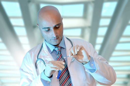 Investigator with vial in his lab