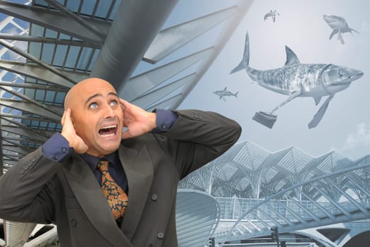 Scared businessman with big sharks all around