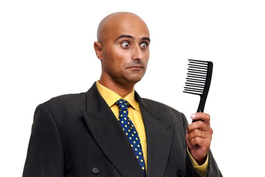Bald businessman with a comb isolated against a white background