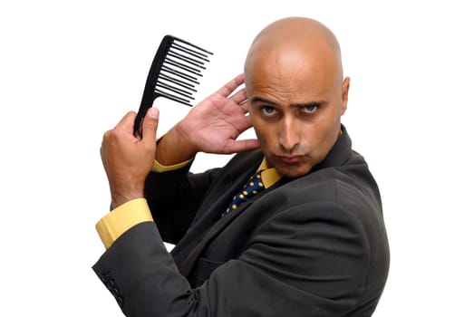 Bald businessman with a comb isolated against a white background