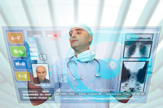 Doctor with hightech computer screen viewing patient data