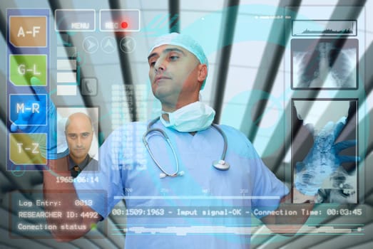 Doctor with hightech computer screen viewing patient data