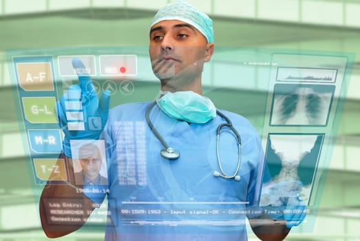 Doctor with hightech computer screen viewing patient data
