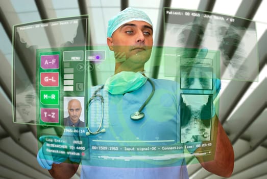 Doctor with hightech computer screen viewing patient data