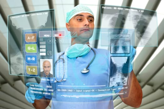 Doctor with hightech computer screen viewing patient data