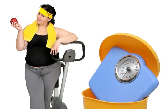 Large woman with an apple and a weight scale in the garbage