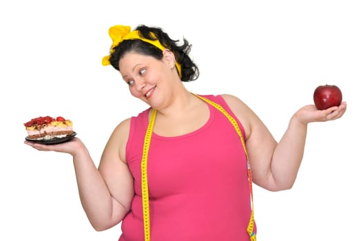 Large girl with a cake in one hand and an apple in the other