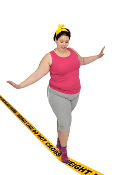Large girl walking over a yellow line isolated in white