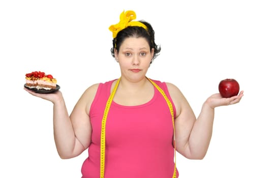 Large girl with a cake in one hand and an apple in the other