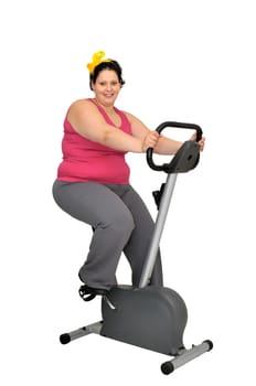 Large girl with fitness bicycle isolated in white