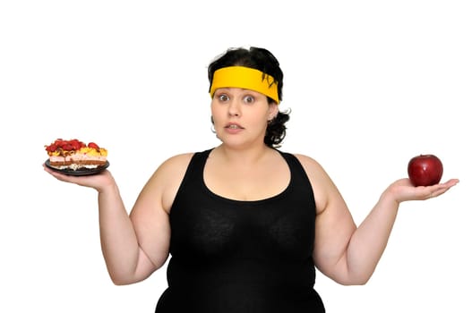 Large girl holding a cake and an apple isolated in white