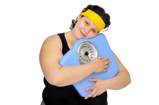 Large girl holding a scale isolated in white