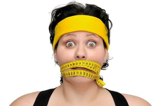 Large girl with measuring tape around her mouth