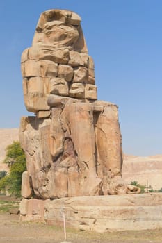 Giant statue of the two colossi of Memnon near the Kings Valley ( Luxor, Egypt )