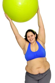 Large girl exercising with big fitness ball isolated in white