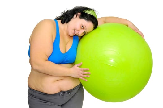 Large girl exercising with big fitness ball isolated in white