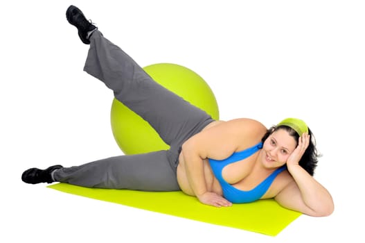 Large girl exercising with big fitness ball isolated in white