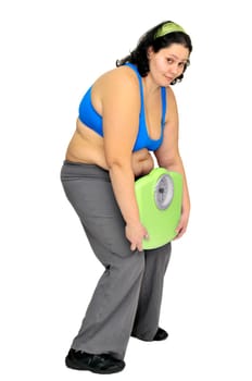 Large girl with weight scale isolated in white