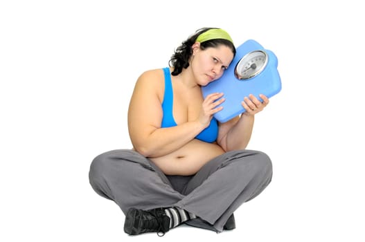 Large girl with weight scale isolated in white