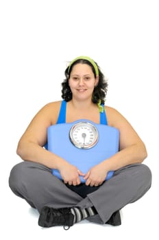 Large girl with weight scale isolated in white