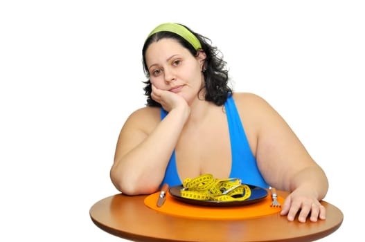 Large girl eating a measuring tape isolated in white