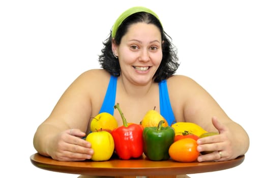 Large girl with fruit and vegetables isolated in white