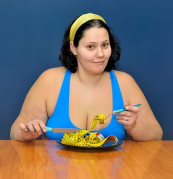 Large girl eating a measuring tape