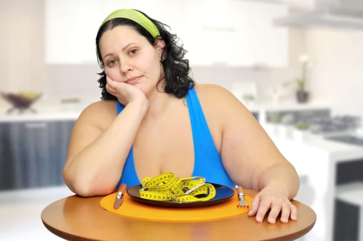 Large girl eating a measuring tape