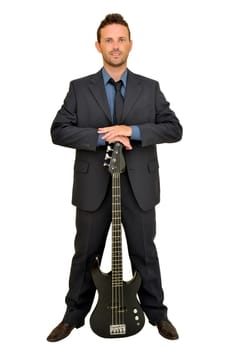 Young man in a suit with guitar