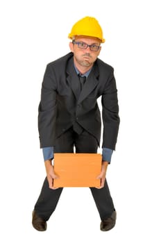 Engineer lifting a heavy brick isolated in white