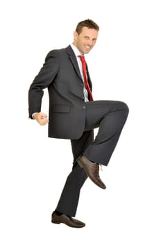 Young businessman jumping isolated in white