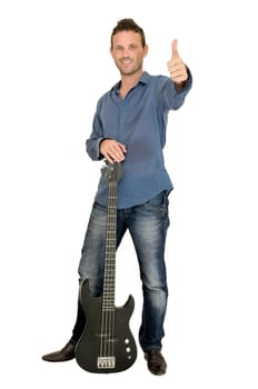 Young man playing guitar isolated in white