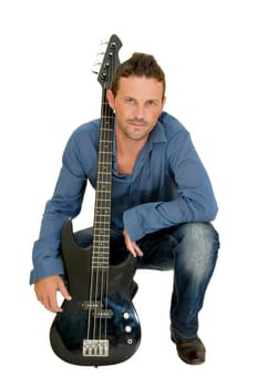Young man posing with a guitar