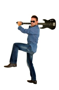 Young man smashing a guitar