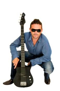 Young man posing with a guitar