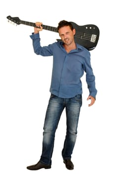 Young man posing with a guitar