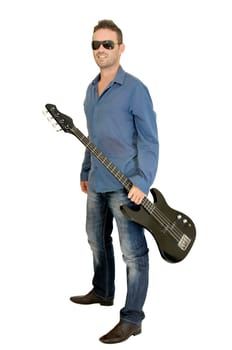 Young man posing with a guitar