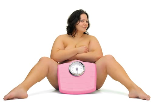 Beautiful nude large girl with weight scale isolated in white
