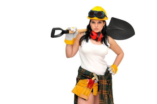 Young sexy construction worker girl with a shovel isolated in white