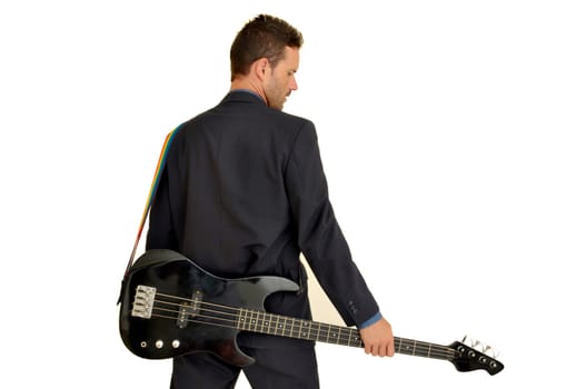 Young man in a suit with guitar