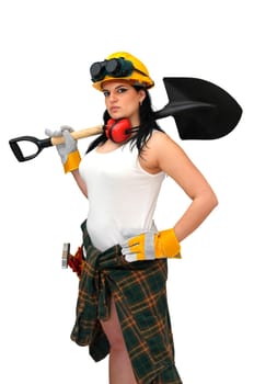 Young sexy construction worker girl with a shovel isolated in white