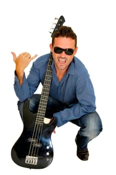 Young man posing with a guitar