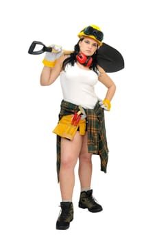 Young sexy construction worker girl with a shovel isolated in white