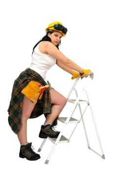 Young sexy construction worker girl with a ladder isolated in white